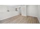 Spacious hallway featuring arched doorways and modern flooring at 520 Stonewall Ave, Haines City, FL 33844
