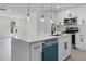 Modern kitchen featuring white cabinetry, stainless steel appliances, quartz countertops and pendant lighting at 520 Stonewall Ave, Haines City, FL 33844