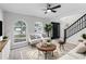 Bright living room with neutral tones, arched windows, and modern decor, offering a welcoming atmosphere at 520 Stonewall Ave, Haines City, FL 33844