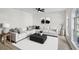 Stylishly furnished living room with a comfortable white sectional, modern decor, and a large arched window at 520 Stonewall Ave, Haines City, FL 33844