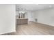 Open-concept area with modern kitchen in the background and spacious flooring at 520 Stonewall Ave, Haines City, FL 33844