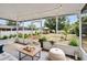 The screened patio offers an outdoor living space overlooking a landscaped backyard at 520 Stonewall Ave, Haines City, FL 33844