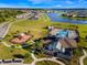Aerial view of the community clubhouse, playground, and pool, all nestled by a scenic lake at 5226 Northern Flicker Dr, St Cloud, FL 34771