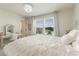 Charming bedroom featuring a vanity, large window, and natural light at 5226 Northern Flicker Dr, St Cloud, FL 34771