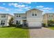 Charming two-story home with a well-manicured lawn and a two-car garage at 5226 Northern Flicker Dr, St Cloud, FL 34771