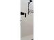 Contemporary shower space with white tile walls, rainfall shower head, and built-in shampoo niche at 5226 Northern Flicker Dr, St Cloud, FL 34771
