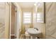 Bright bathroom with toilet and a white sink at 5822 Flori Ln, Orlando, FL 32808
