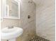 Bathroom with a modern shower with mosaic tile floors and brushed metal fixture at 5822 Flori Ln, Orlando, FL 32808