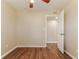 A comfortable bedroom featuring wood-style floors and a view into another room at 5822 Flori Ln, Orlando, FL 32808