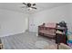 Bright bedroom with ample space, featuring modern flooring, neutral walls, and ample closet space at 601 Blackstone Ave, Deltona, FL 32725