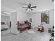 Bright bedroom with a crib, rocking chair, and a view from the window at 601 Blackstone Ave, Deltona, FL 32725