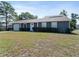 Charming single-story home featuring a well-maintained lawn, neutral exterior and attached garage at 601 Blackstone Ave, Deltona, FL 32725