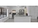 Stylish kitchen featuring white cabinets, stainless appliances, and a granite countertop peninsula at 601 Blackstone Ave, Deltona, FL 32725