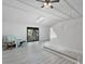 Bright and airy living room with sliding glass doors to a deck and modern ceiling fan at 601 Blackstone Ave, Deltona, FL 32725