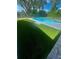 Lush artificial turf surrounds the refreshing pool area, providing a serene outdoor retreat at 601 Blackstone Ave, Deltona, FL 32725