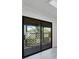 Large sliding glass doors invite the outside in, leading to a private deck area at 601 Blackstone Ave, Deltona, FL 32725