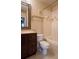 Bathroom showcasing a vanity with drawers, toilet, and tub with tile surround at 6512 Swissco Dr # 1428, Orlando, FL 32822