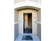 View of front door showcasing the home's entry to carpeted stairs and tile flooring at 6512 Swissco Dr # 1428, Orlando, FL 32822