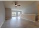 Spacious living room with an airy feel, a ceiling fan, light-colored floors, and natural light at 6512 Swissco Dr # 1428, Orlando, FL 32822