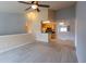 Inviting living area featuring tile floors, neutral walls, and a view to the kitchen and dining area at 6512 Swissco Dr # 1428, Orlando, FL 32822