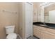 Well-maintained bathroom features a single vanity, a toilet, and a shower with neutral colored walls at 6611 Time Square Ave # 103, Orlando, FL 32835