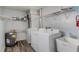 Functional laundry room featuring a utility sink, washer, dryer, and ample storage space at 6611 Time Square Ave # 103, Orlando, FL 32835