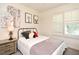 Charming bedroom featuring a cozy bed, a large window, and whimsical decor, creating a playful atmosphere at 677 Post Oak Cir # 115, Altamonte Springs, FL 32701