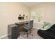 Neutral bedroom with desk, storage, and window letting in natural light at 677 Post Oak Cir # 115, Altamonte Springs, FL 32701