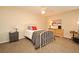 Comfortable bedroom with neutral walls and carpet and featuring cozy furnishings and ample natural light at 677 Post Oak Cir # 115, Altamonte Springs, FL 32701
