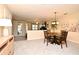 Open concept dining area featuring modern decor, a chandelier, and seamless access to the living area at 677 Post Oak Cir # 115, Altamonte Springs, FL 32701