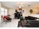 Inviting living room featuring a ceiling fan, comfortable seating, and stylish decor, great for relaxation at 677 Post Oak Cir # 115, Altamonte Springs, FL 32701