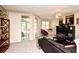 Inviting living room featuring comfortable seating, bright windows, and sliding glass doors to outdoor patio at 677 Post Oak Cir # 115, Altamonte Springs, FL 32701