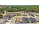Aerial view of neighborhood featuring single Gathering homes on a tree-lined street and picturesque landscape at 7054 Cruz Ct, Lakeland, FL 33813