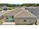 Backyard featuring a neutral colored exterior and windows and sliding glass doors with a cement patio at 7054 Cruz Ct, Lakeland, FL 33813