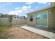 Backyard of house with white fence, small tree, and a cement patio at 7054 Cruz Ct, Lakeland, FL 33813