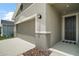 Close up of the front of the home with garage door, front door, and landscaping at 7054 Cruz Ct, Lakeland, FL 33813