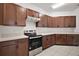 Functional kitchen with stainless steel appliances, ample counter space, and sleek cabinets, perfect for cooking at 7054 Cruz Ct, Lakeland, FL 33813