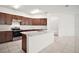 Modern kitchen with stainless steel appliances and a large kitchen island, ideal for cooking and gatherings at 7054 Cruz Ct, Lakeland, FL 33813