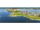 Wide shot of a lakeside community with a variety of home styles and sizes at 7500 Alpine Butterfly Ln, Orlando, FL 32819