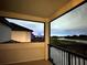 Enjoy the lovely balcony view overlooking the water and distant ferris wheel at this beautiful property at 7500 Alpine Butterfly Ln, Orlando, FL 32819
