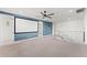 Spacious bonus room with carpet, a ceiling fan, and a media screen, ideal for entertainment at 7500 Alpine Butterfly Ln, Orlando, FL 32819