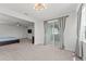 Bonus room features sliding glass door leading to the screened porch at 7500 Alpine Butterfly Ln, Orlando, FL 32819