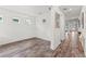 Dining room with wood floors, neutral walls, and modern lighting fixture at 7500 Alpine Butterfly Ln, Orlando, FL 32819