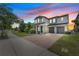 Beautiful two-story home with a brick driveway and attached two-car garage at 7500 Alpine Butterfly Ln, Orlando, FL 32819