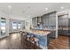 Kitchen with granite counters, island, pendant lighting, and bar stool seating at 7500 Alpine Butterfly Ln, Orlando, FL 32819