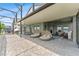 Spacious patio with lounge chairs and lake views at 7500 Alpine Butterfly Ln, Orlando, FL 32819