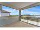 View from screened porch of lake and neighboring homes at 7500 Alpine Butterfly Ln, Orlando, FL 32819