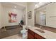 Elegant bathroom with a garden tub, updated vanity, and neutral tones to enhance the space at 7628 Bay Port Rd # 43, Orlando, FL 32819