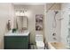 Stylish bathroom with a modern vanity, decorative mirror, and shower/tub combo, offering a fresh and updated space at 7628 Bay Port Rd # 43, Orlando, FL 32819