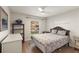 Cozy bedroom with a window view, ceiling fan, and neutral tones, providing a serene and comfortable retreat at 7628 Bay Port Rd # 43, Orlando, FL 32819